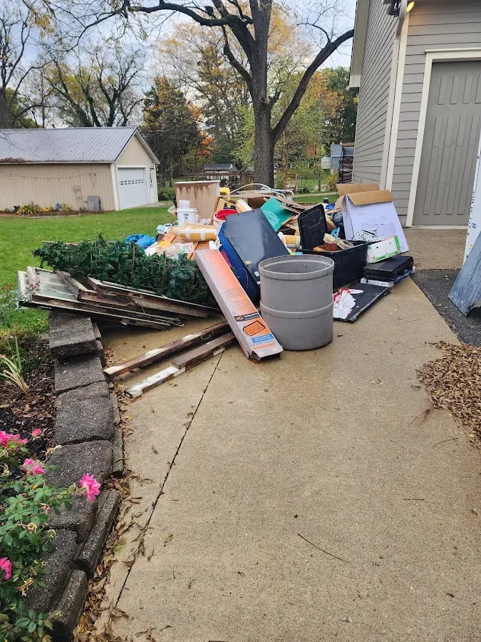 Dumpster being loaded with debris for 3 Yard Dumpster Rental in Hartford